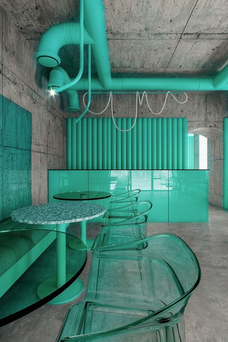 Trendy Cafe Design: A Bold Fusion of Turquoise, Concrete, and Industrial Elements