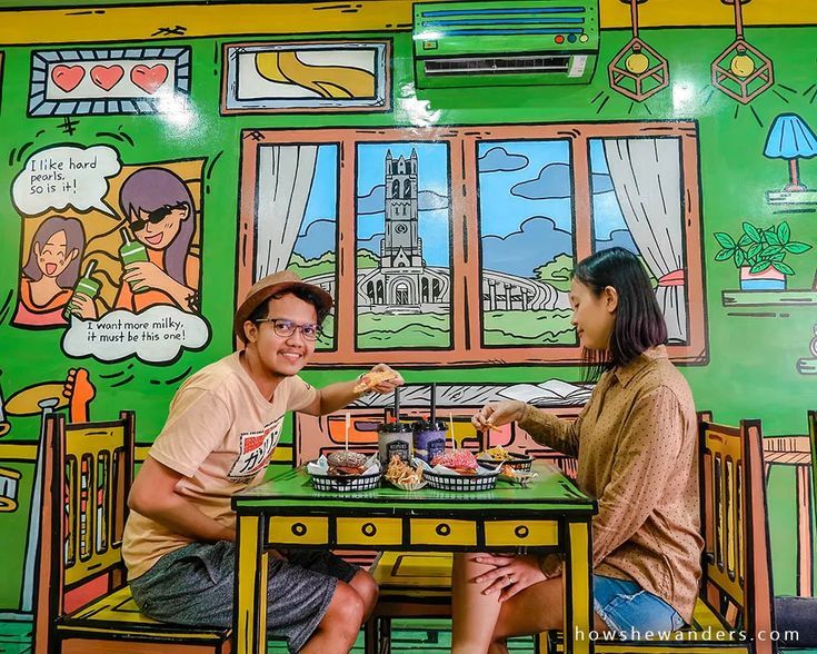 Vibrant Cafe Design: Colorful Murals and Whimsical Decor Create a Welcoming Social Atmosphere