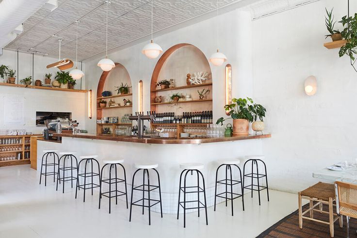 Minimalist Cafe Design: A Clean, Inviting Space with Natural Lighting and Elegant Accents