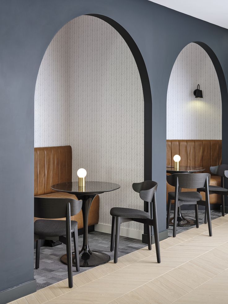 Contemporary Cafe Design: Intimate Archways, Cozy Dark Palette, and Minimalist Elegance