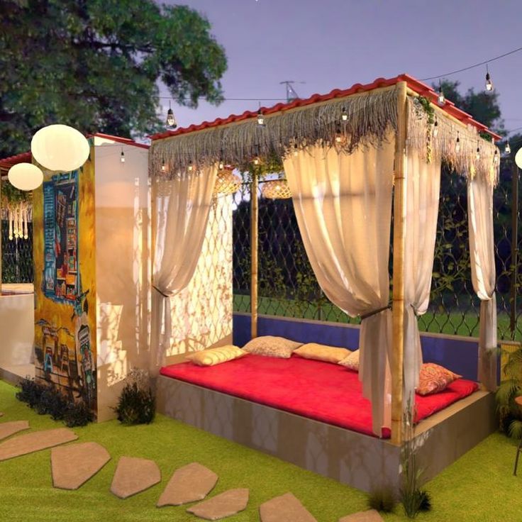 Charming Outdoor Seating Area with Canopy, Fairy Lights, and Artistic Mural for Relaxation