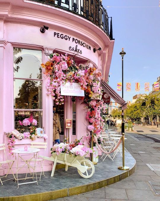 Charming Pink Cafe: A Whimsical Retreat with Floral Charm and Cozy Outdoor Seating