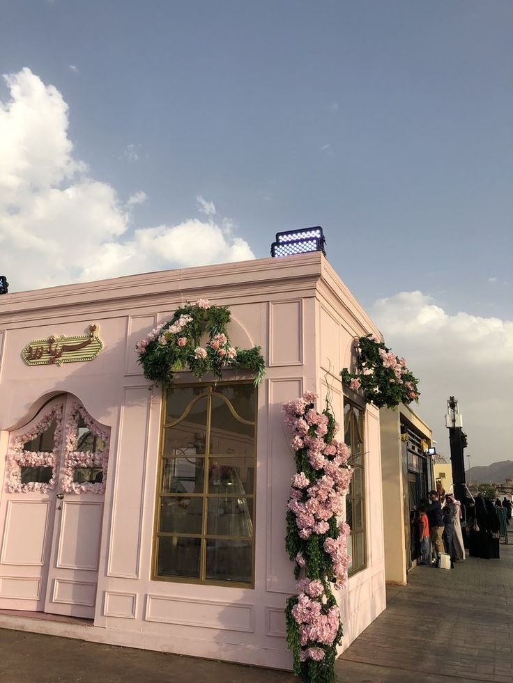 Charming Pastel Pink Cafe with Floral Elegance and Romantic Ambiance