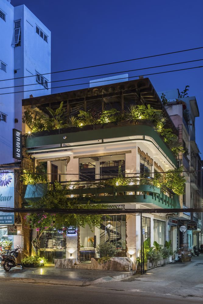 Modern Cafe Boasts Three Stories of Greenery and Stylish Design for a Welcoming Atmosphere