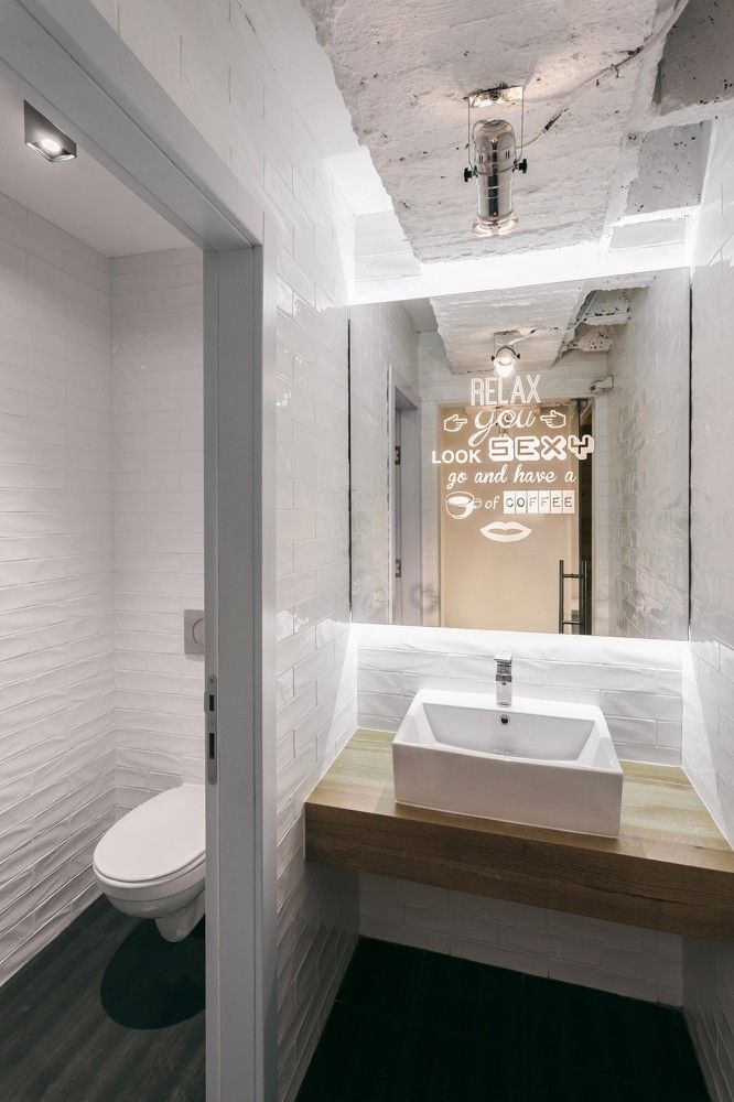 Modern Minimalistic Cafe Restroom Design: A Blend of Clean Lines, Industrial Touches, and Inviting Atmosphere