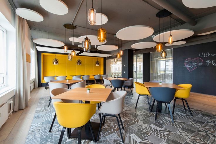 Modern Cafe Design: Vibrant Atmosphere with Colorful Seating and Stylish Decor