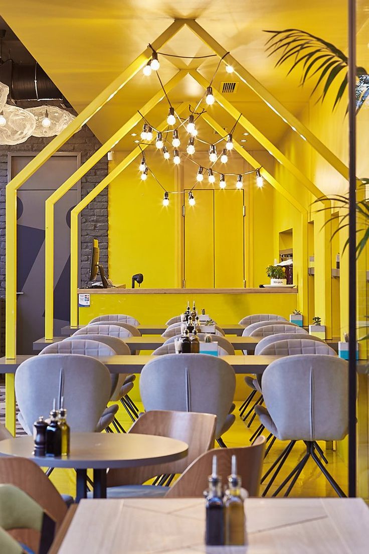 Cheerful Cafe Design Blends Vibrant Colors, Geometry, and Comfort for a Welcoming Atmosphere