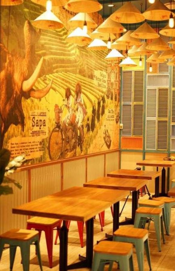 Vibrant Cafe Design Blending Artistic Murals and Cozy Furnishings for a Welcoming Atmosphere