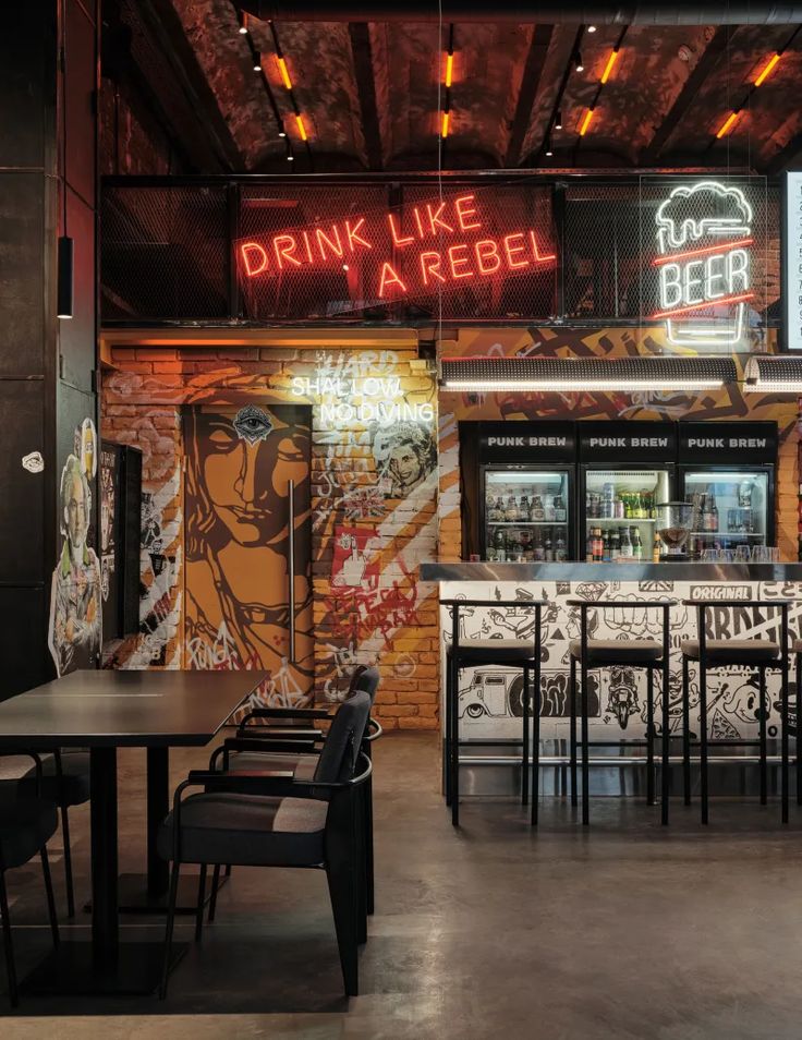 Urban Edgy Cafe Design Blends Industrial Elements with Vibrant Street Art for a Trendy Experience