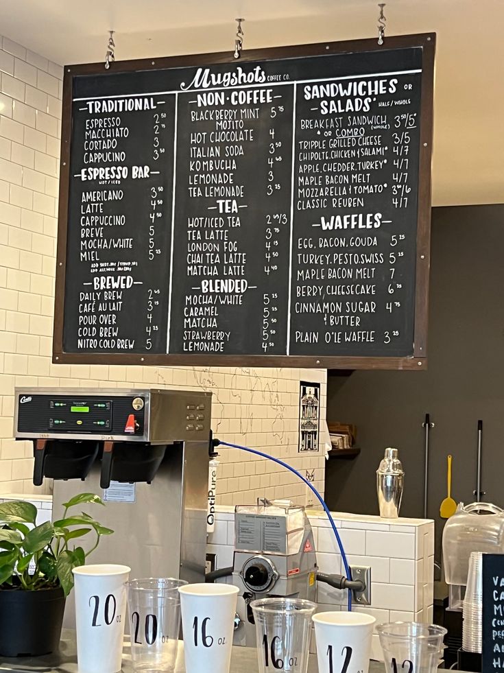 Modern Cafe Design Features Prominent Chalkboard Menu and Rustic Metal Accents