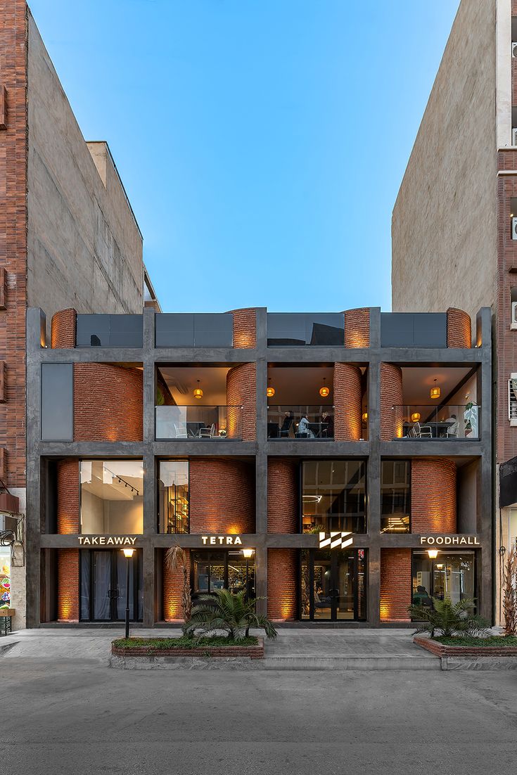 Modern Industrial Cafe Design Featuring Striking Facade, Natural Light, and a Dynamic Three-Level Experience