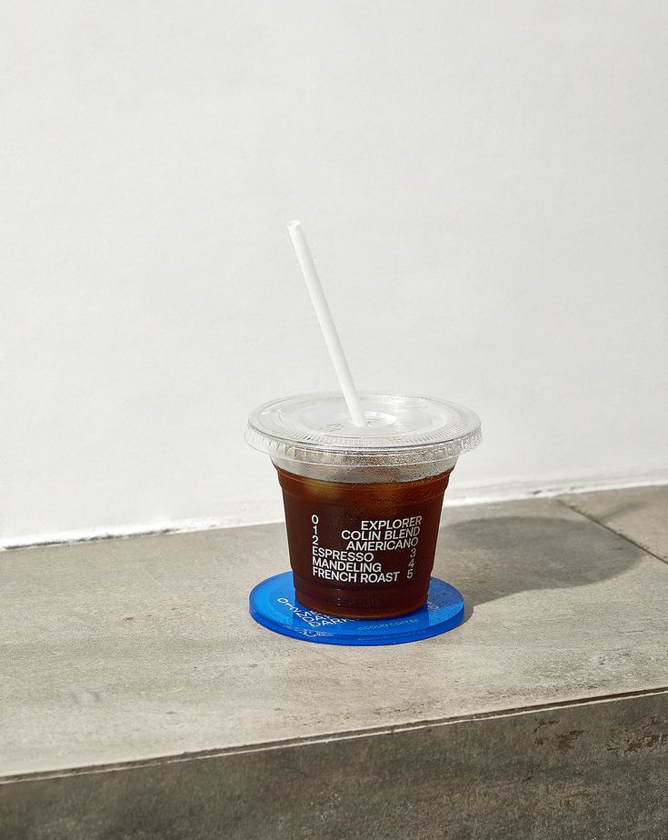 Stylish Minimalist Cafe Aesthetic Highlighted by Iced Coffee on Vibrant Coaster