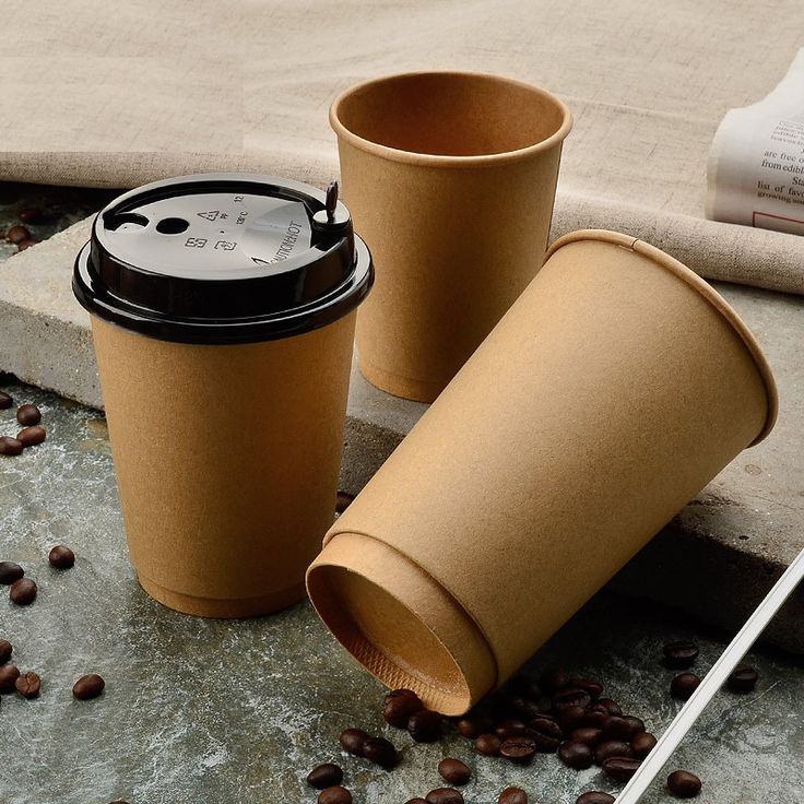 Minimalist Coffee Cups on Textured Surface Evoking Warmth and Sustainability