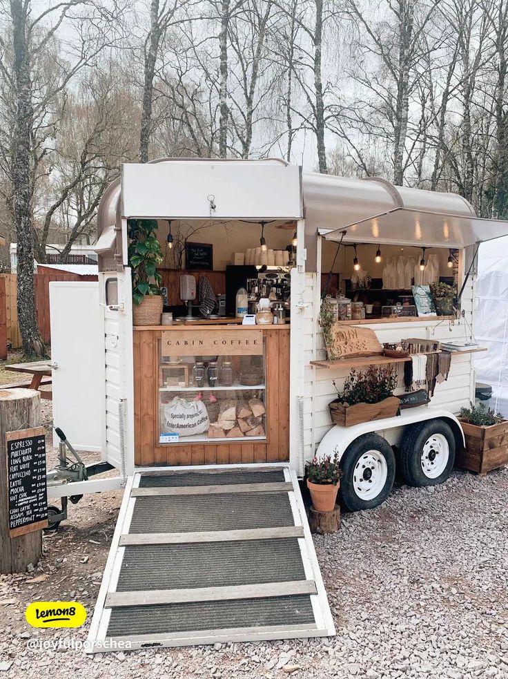 Charming Rustic Cafe Design Features Mobile Coffee Cart and Inviting Outdoor Ambiance