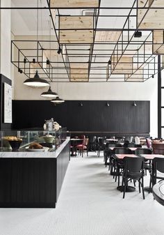 Modern Minimalist Cafe Design: A Bright, Textured Space with Industrial Accents