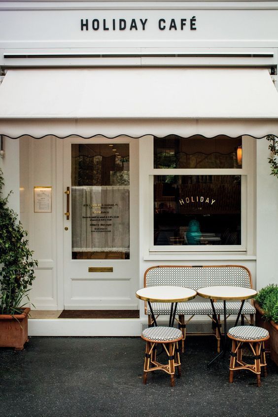 Charming Cafe Design: Inviting Exterior with Elegant Awning and Cozy Outdoor Seating