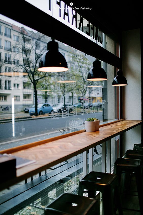 Modern Cafe Design: Inviting Atmosphere with Natural Light and Industrial Touches