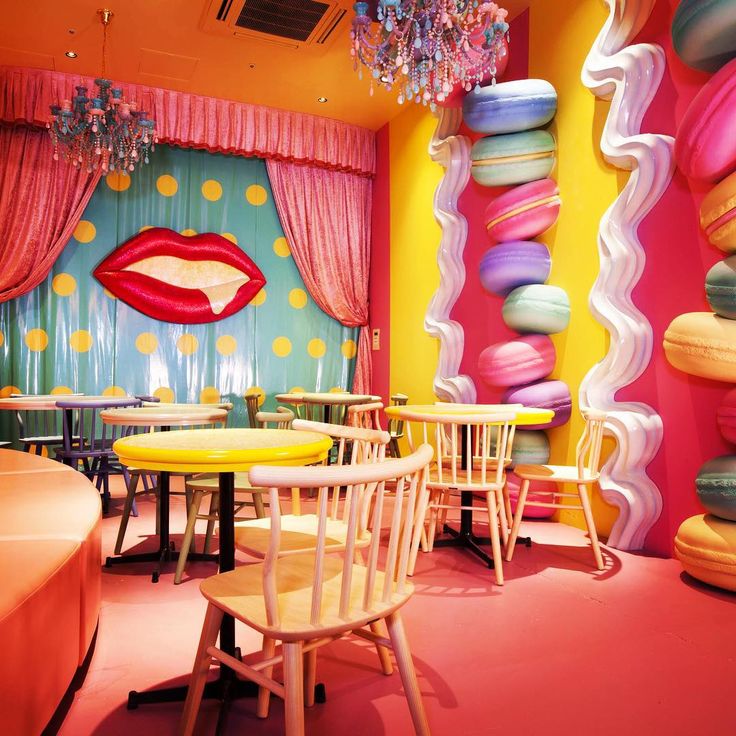 Vibrant Cafe Design: A Playful Blend of Bold Colors and Whimsical Decor for a Lively Dining Experience