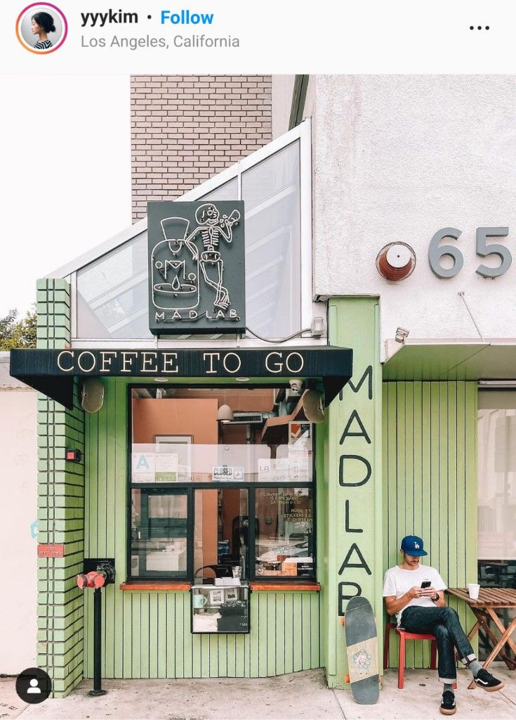 Contemporary Cafe Design with Playful Green Palette and Inviting Open Atmosphere