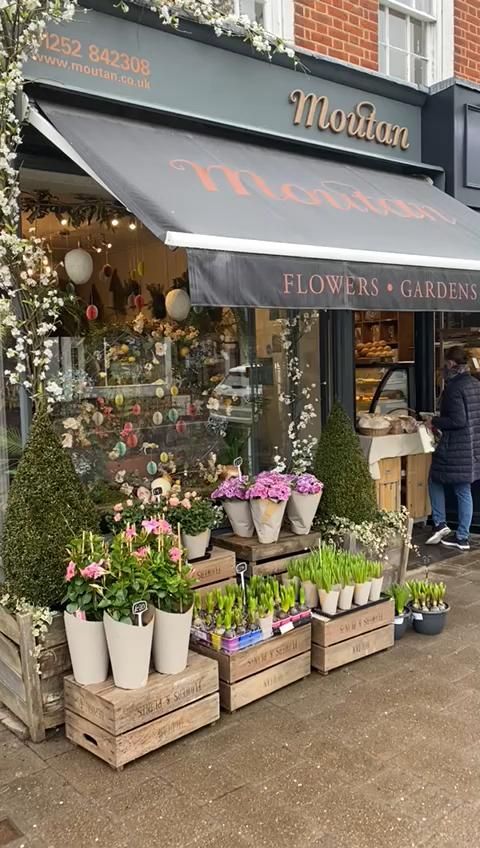 Charming Cafe Design: A Welcoming Atmosphere with Vibrant Flowers and Tempting Baked Goods