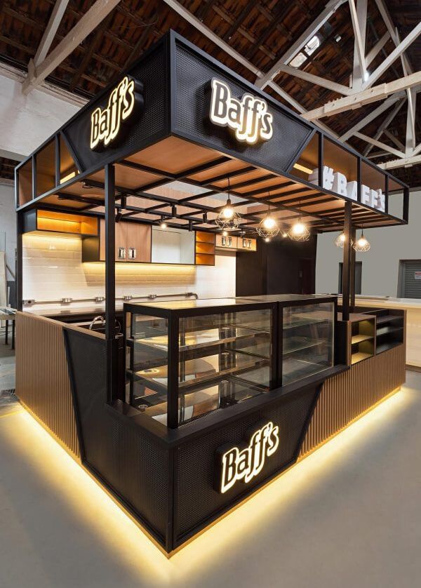 Modern Industrial Cafe Design with Black and Gold Aesthetic and Inviting Atmosphere