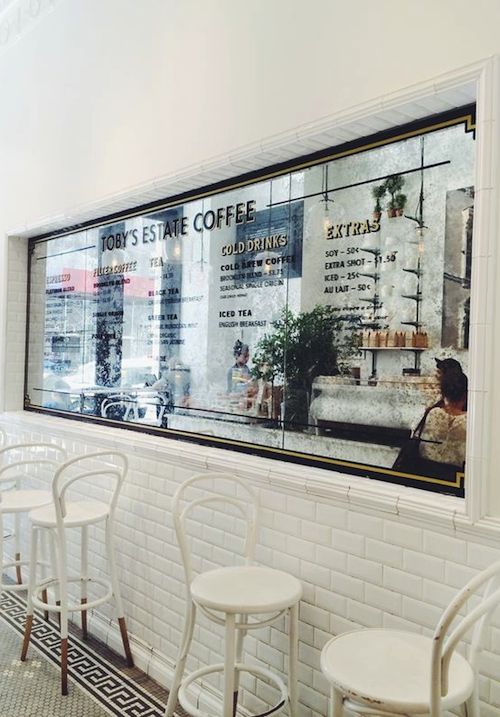 Bright and Inviting Cafe Design: Modern Aesthetics with Cozy Elements