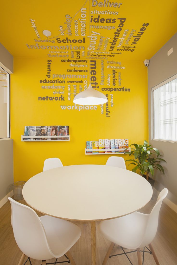 Energizing Cafe Design with Yellow Accents and Inviting Atmosphere for Collaboration and Creativity