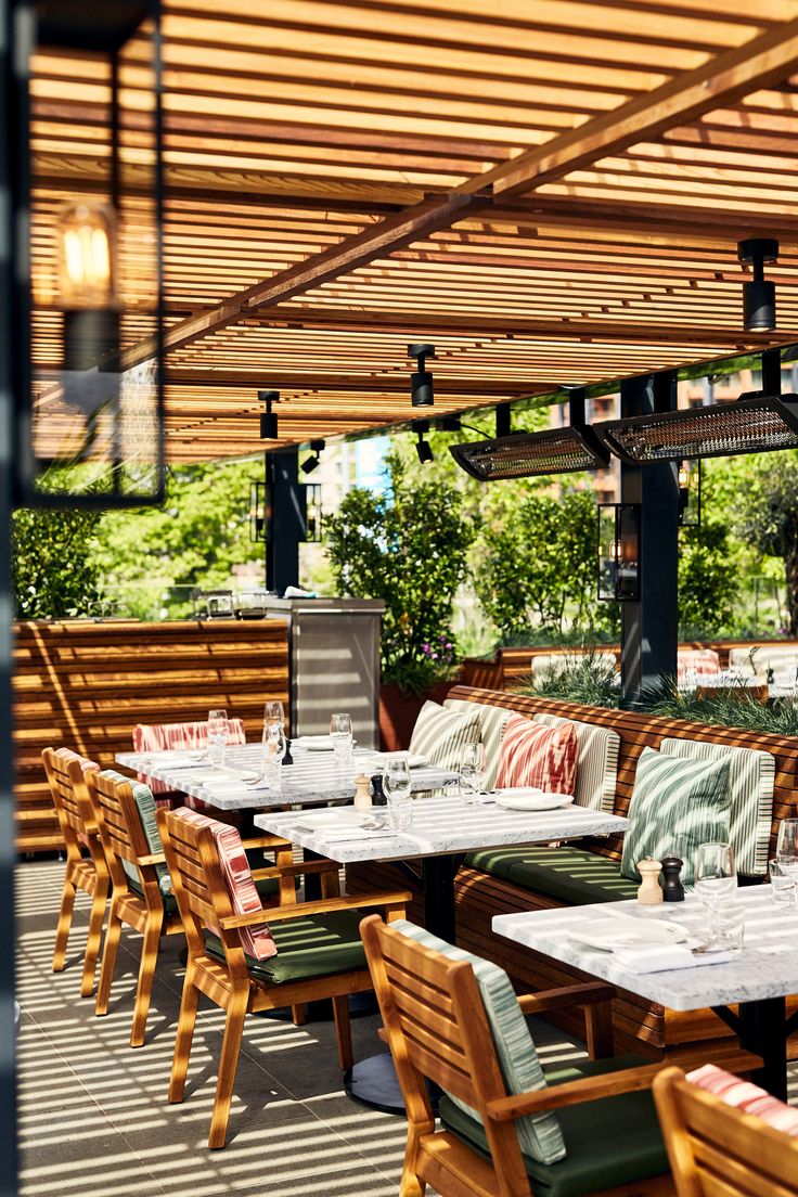 Charming Cafe Design with Inviting Outdoor Seating, Stylish Pergola, and Cozy Ambiance