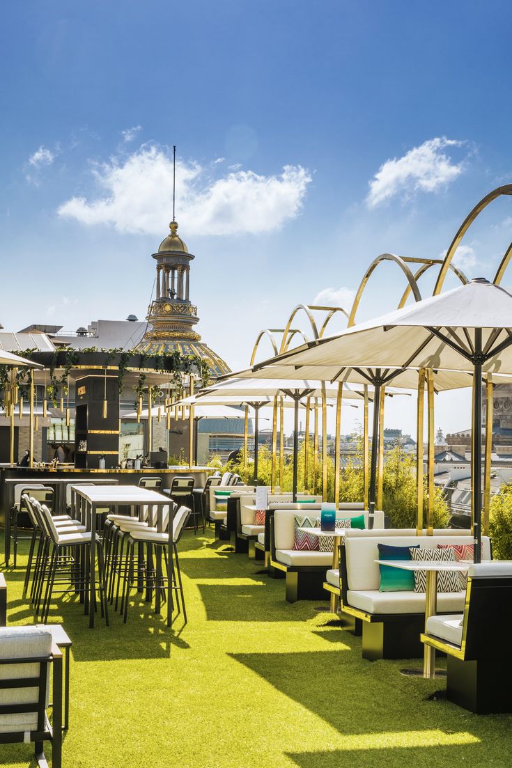 Stylish Rooftop Cafe Design: Modern Ambiance with Panoramic Views and Playful Decor