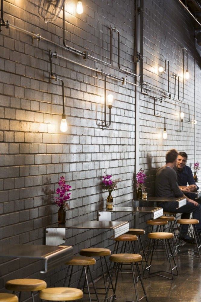 Modern Industrial Cafe Design with Inviting Ambiance and Functional Aesthetics