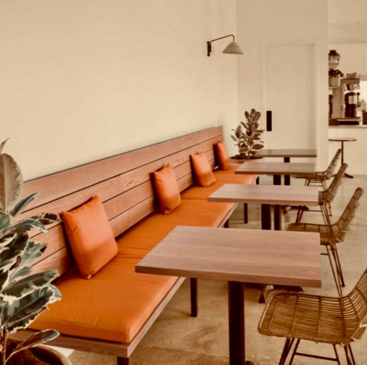 Cozy Cafe Design Blends Warm Wood, Bright Accents, and Modern Minimalism for an Inviting Atmosphere