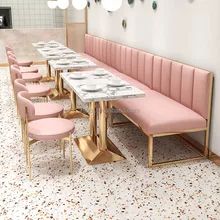 Chic Cafe Design Balances Comfort and Elegance with Pastel Colors and Sophisticated Accents