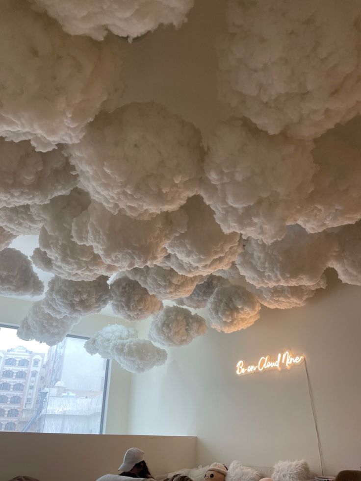 Whimsical Cafe Design Evokes Dreamy Atmosphere with Cloud-Adorned Ceiling