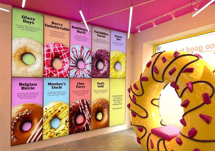 Playful Cafe Design with Whimsical Decor and Oversized Donut Seating