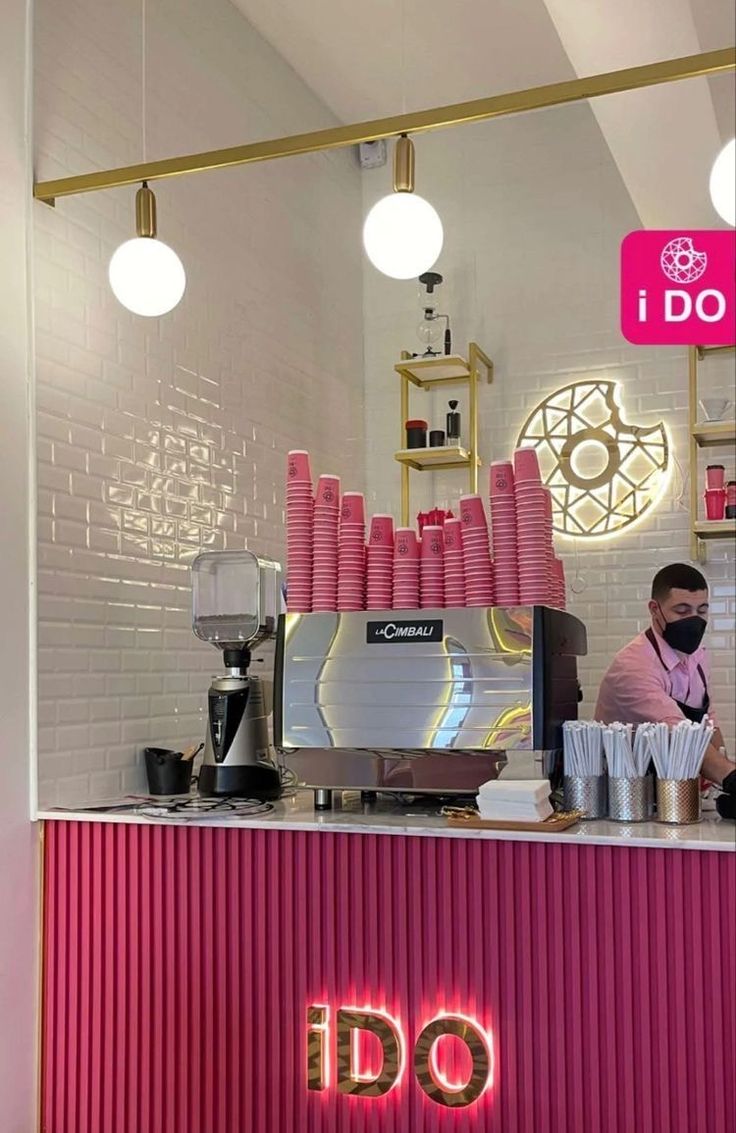 Modern Cafe Design: A Playful Fusion of Pink Tones and Clean Lines