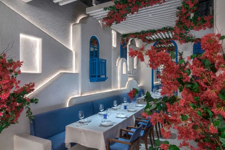 Charming Mediterranean Cafe Design: Elegant, Inviting Atmosphere with Lush Greenery and Vibrant Accents