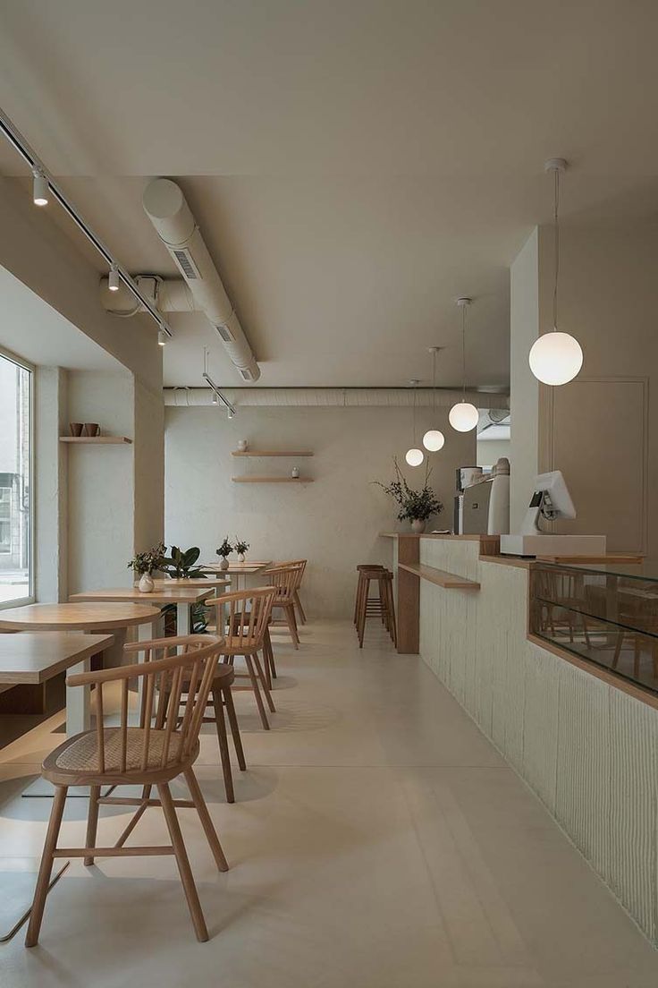 Modern Minimalist Cafe Design: A Serene Space with Natural Materials and Inviting Atmosphere