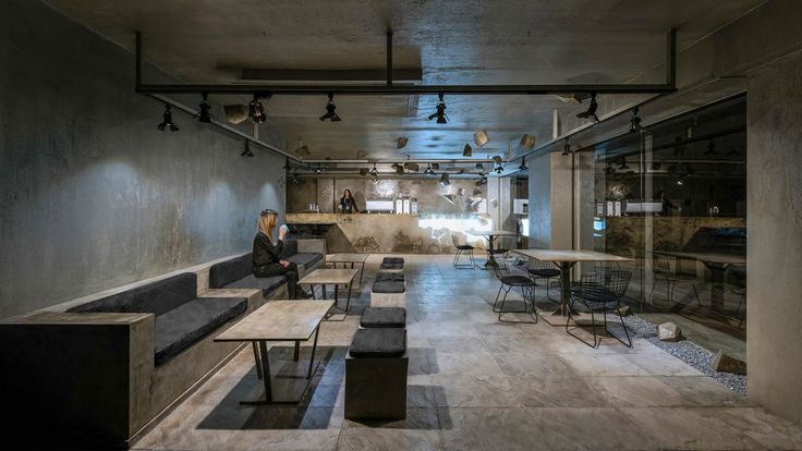 Modern Industrial Cafe: A Sleek Urban Retreat with Minimalist Design and Inviting Ambiance