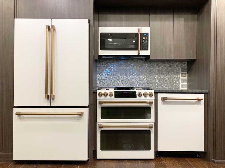 Sleek Modern Kitchen Design with White Appliances and Dark Wood Accents for a Contemporary Cafe Aesthetic