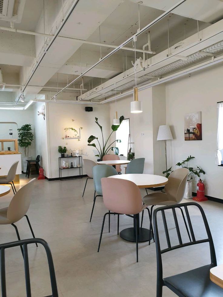 Modern Minimalist Cafe: A Bright, Airy Space with Industrial Charm and Inviting Ambiance