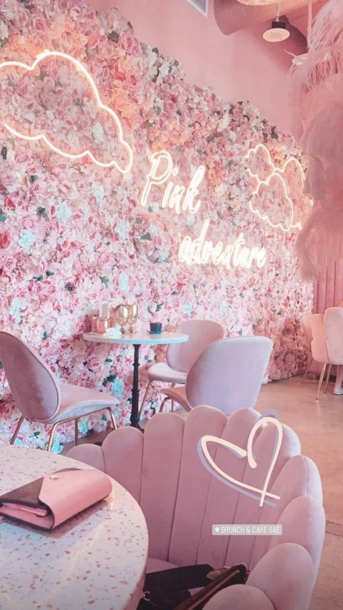 Whimsical Cafe Design: A Charming Blend of Soft Pink Tones and Floral Decor for Social Gatherings