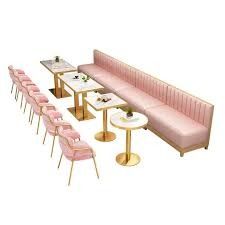 Chic Modern Cafe Design with Plush Pink Seating and Elegant Gold Accents