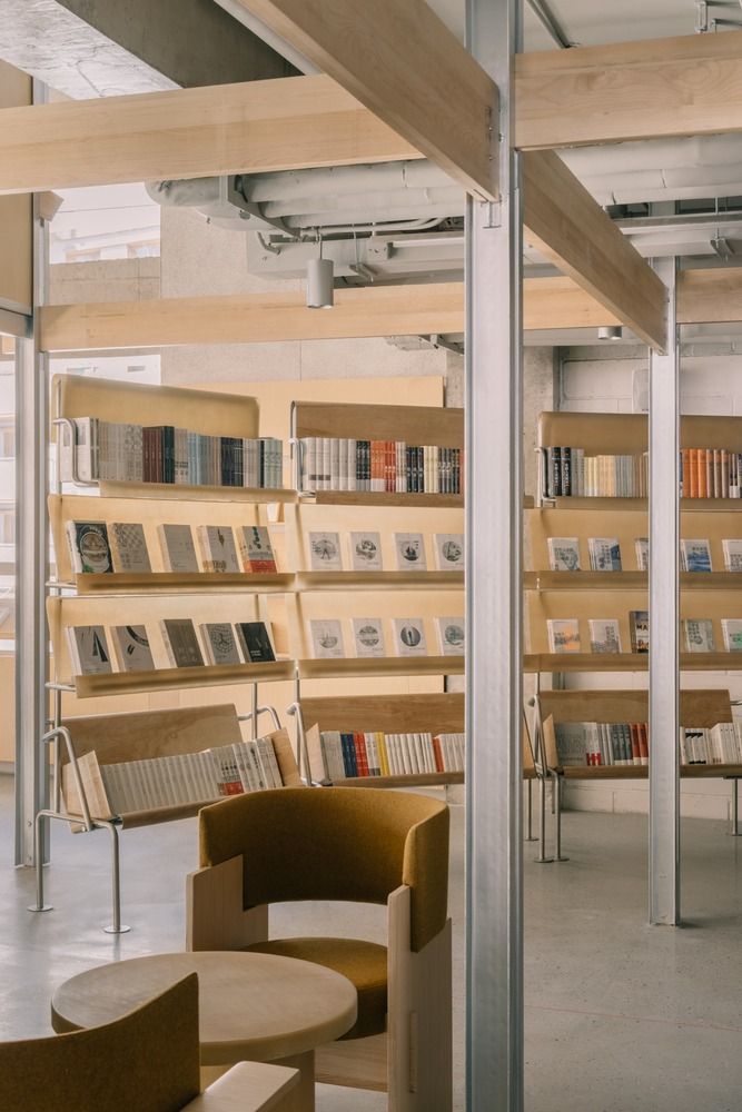 Modern Cafe Design Fuses Wood and Metal for a Cozy, Library-like Atmosphere