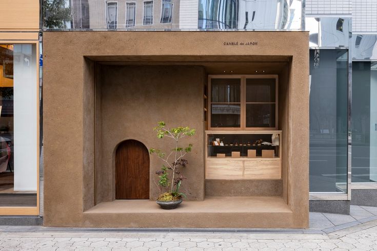 Minimalist Cafe Design Blends Natural Materials for an Inviting Urban Atmosphere