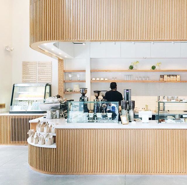 Modern Minimalist Cafe Design: Warm Wood Accents and Functional Layout for an Inviting Atmosphere