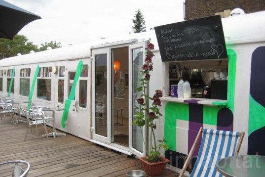 Whimsical Cafe Design Inspired by Train Carriages with Inviting Natural Light and Rustic Charm