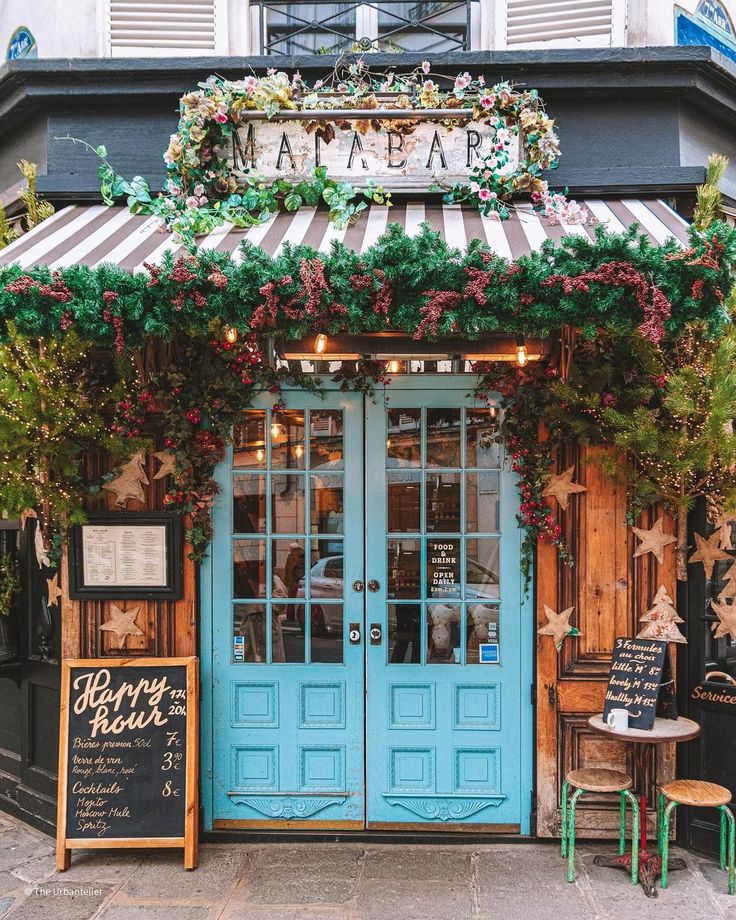 Charming Cafe Design: Inviting Facade with Vibrant Doors and Cozy Elements