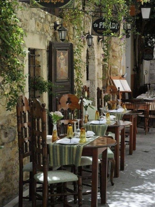 Charming Cafe with Rustic Outdoor Ambiance and Lush Greenery