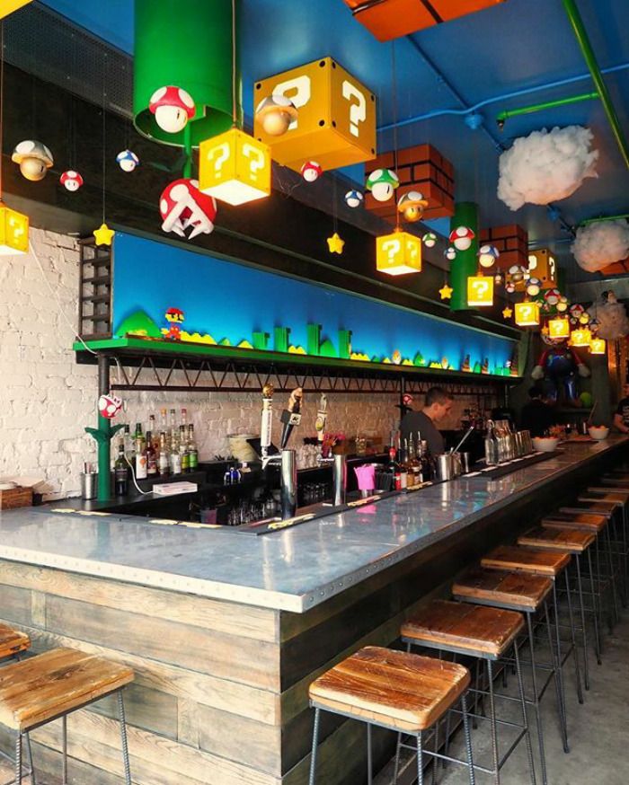 Whimsical Cafe Design Inspired by Retro Video Games Fosters a Vibrant Social Atmosphere