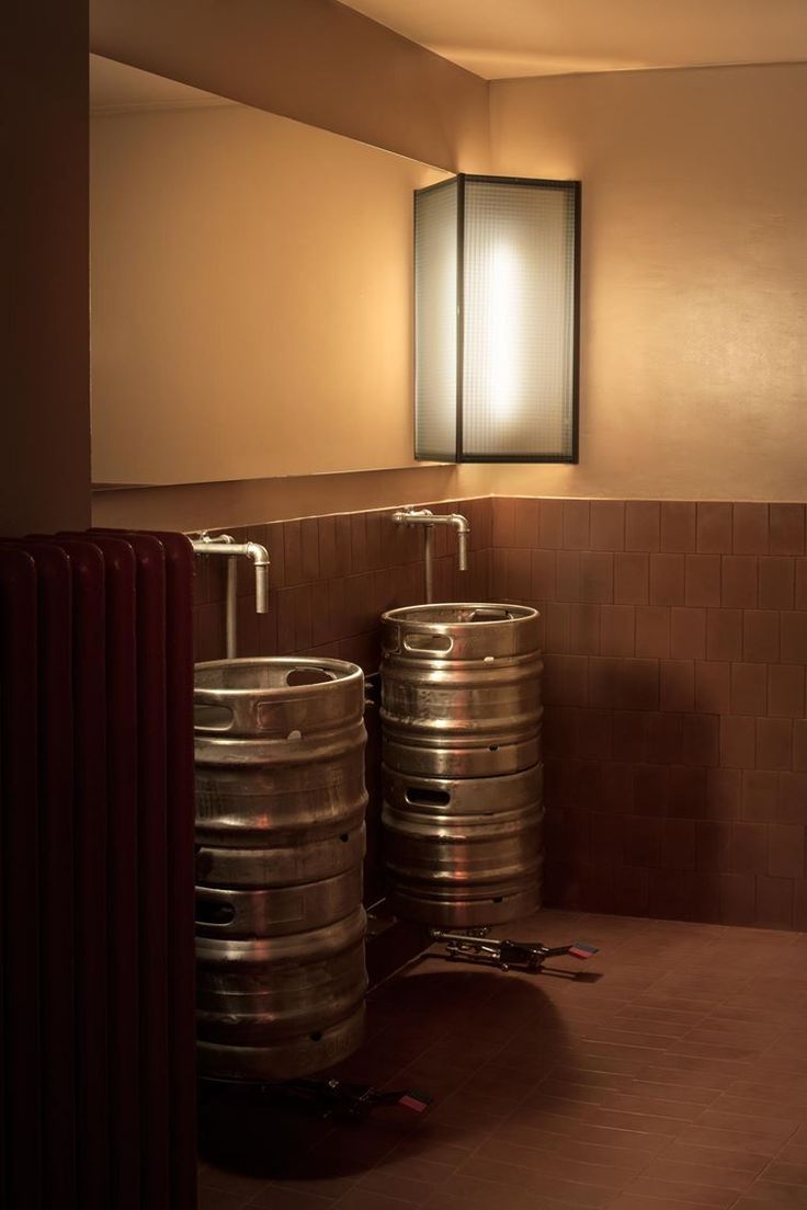 Innovative Cafe Restroom Design Merges Industrial Style with Inviting Warmth